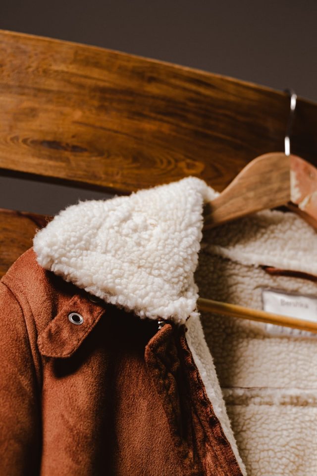 white textile on brown leather bag